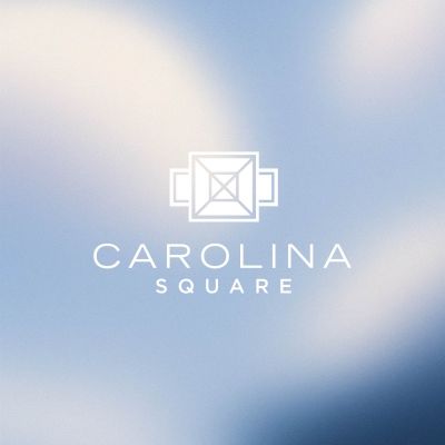 White geometric logo and "Carolina Square" text on a soft blue and white blurred background.
